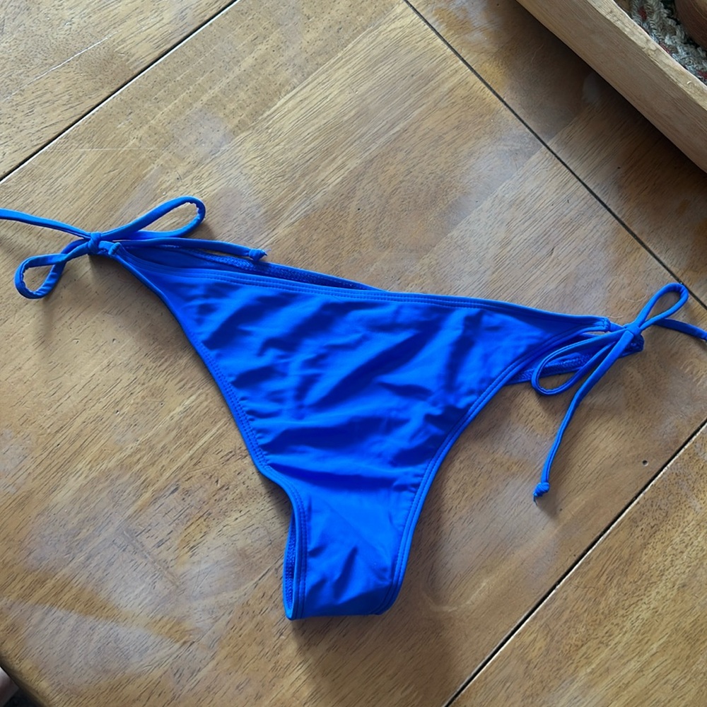 Blue thong bathing suit bottoms never worn large bought in Mexico